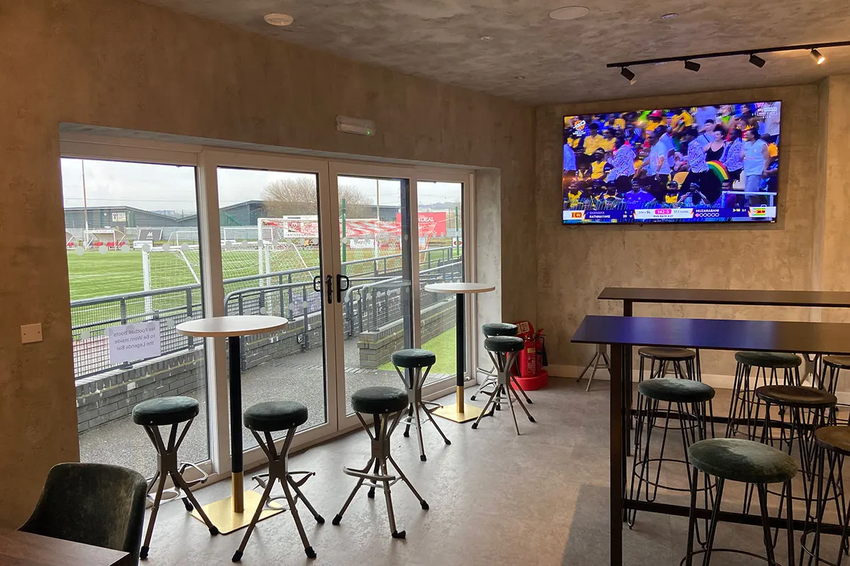 High tables by the pitch-side doors in the Legends Sports Bar